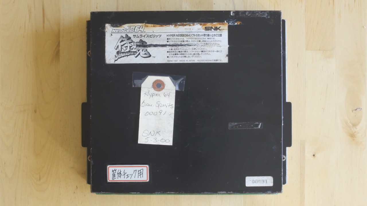 Under this unassuming label and metal case lies the first printed board for an ultra-rare prototype game.