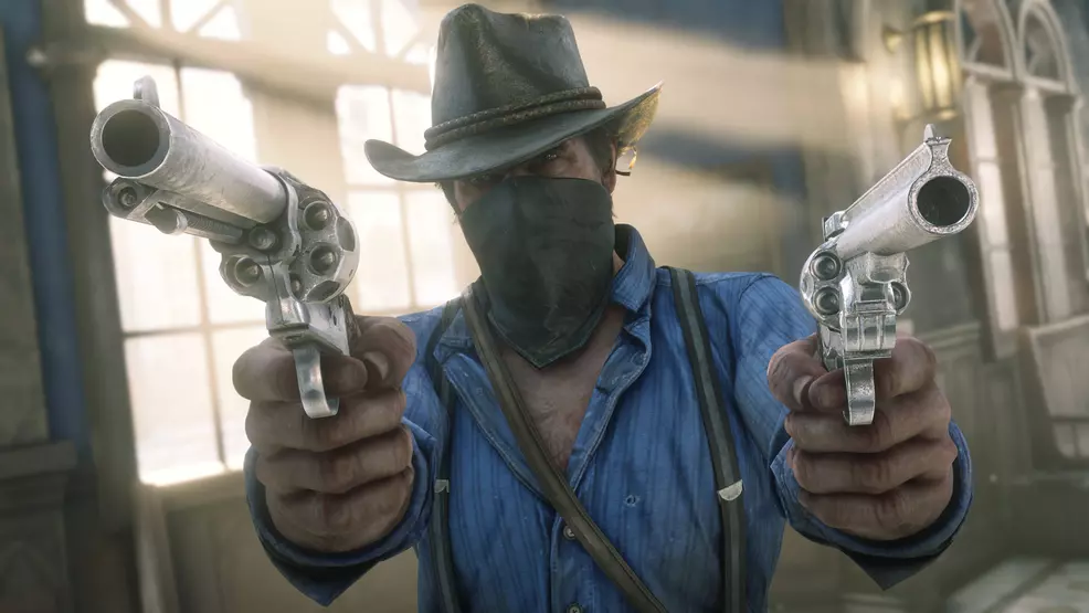 arthur morgan wears a bandana over his mouth, points guns at the camera
