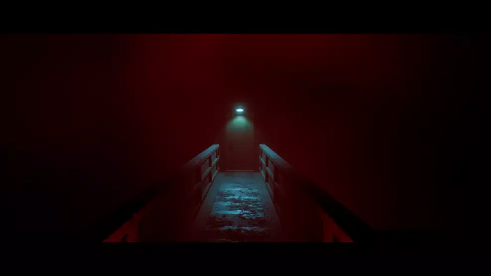 A door at the end of a narrow walkway.