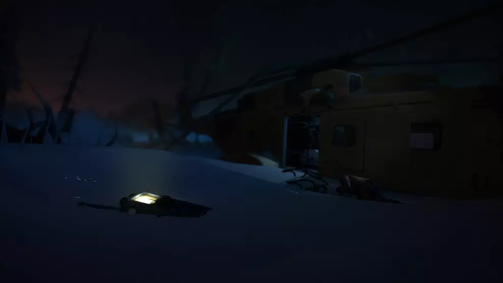 A downed helicopter with a walkie-talkie on the ground in The Long Dark