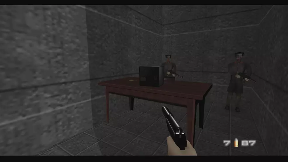 The plane ignition key on a table guarded by two soldiers