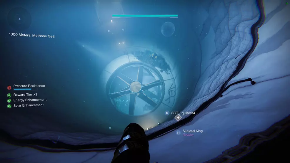 The player drops down a massive cylindrical tunnel with a fan at the bottom