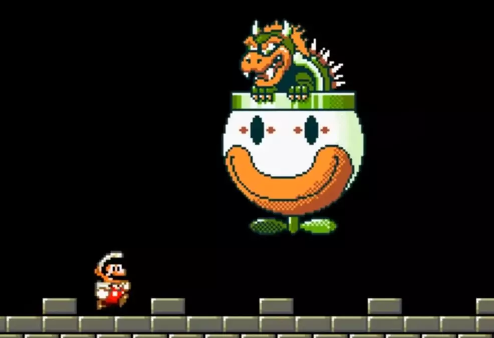 Bowser swoops on Mario in his clown car in Super Mario World.