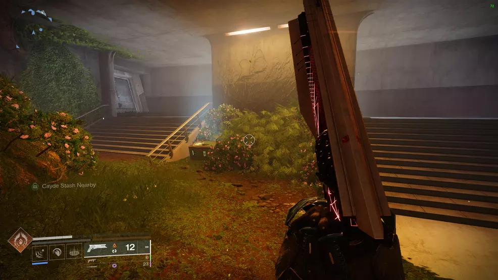 A Cayde's Stash chest among some bushes