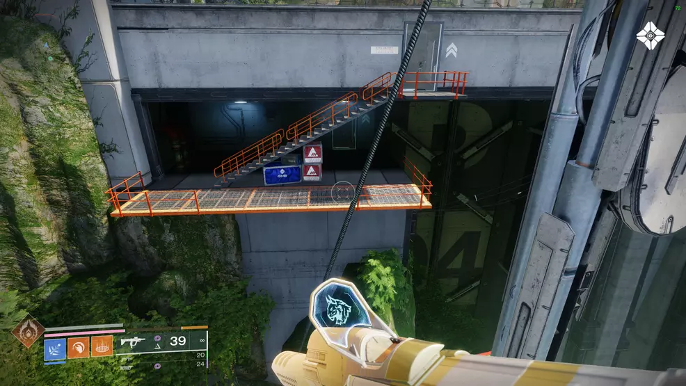 Looking at the crates below the stairs near some hanging platforms