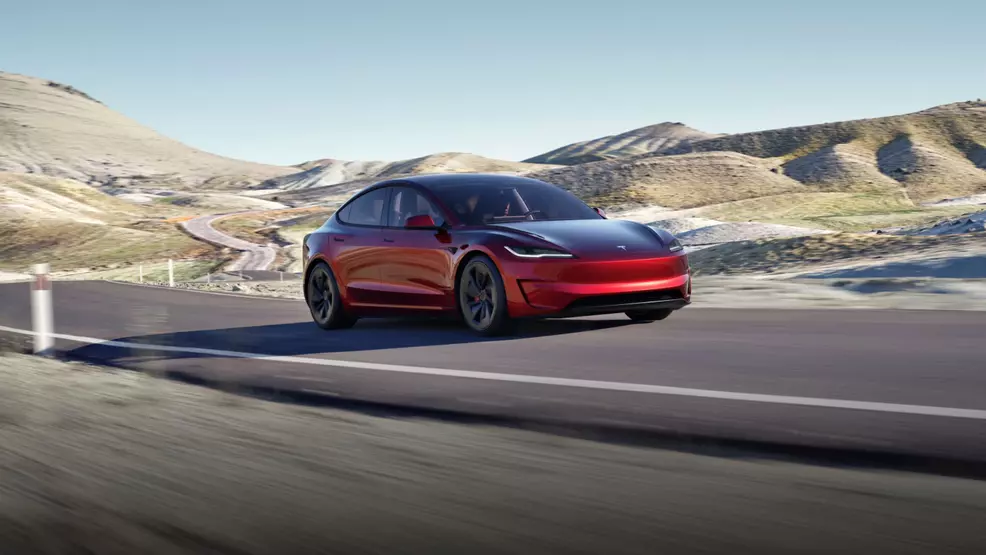 A red Model 3 car.