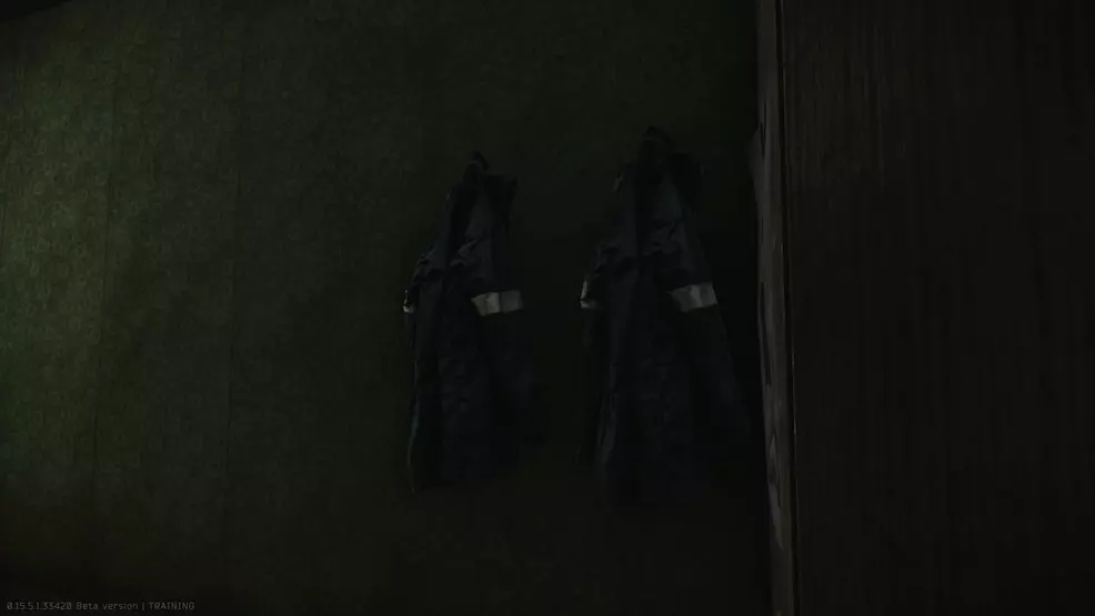 Two jackets hung from the wall.