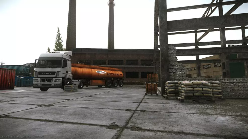It shows a dilapidated structure with a fuel tank in the background.