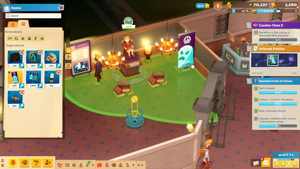 The player arranges decorations around a creepy doll exhibit in Two Point Museum.