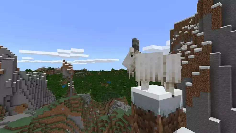 A goat stands on a mountaineer in Minecraft.