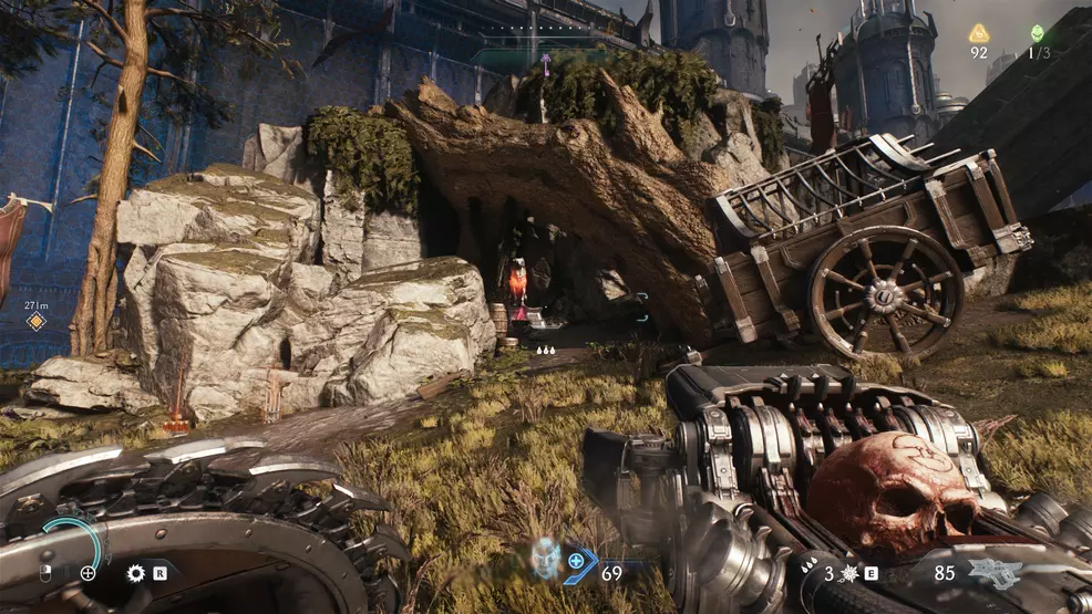 A wolf statue under a fallen tree