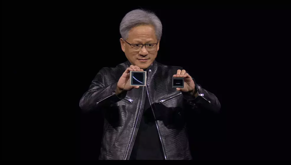 Jensen Huang holds a blackwell chip