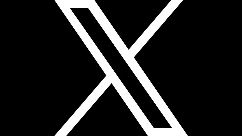 X logo on a black background.