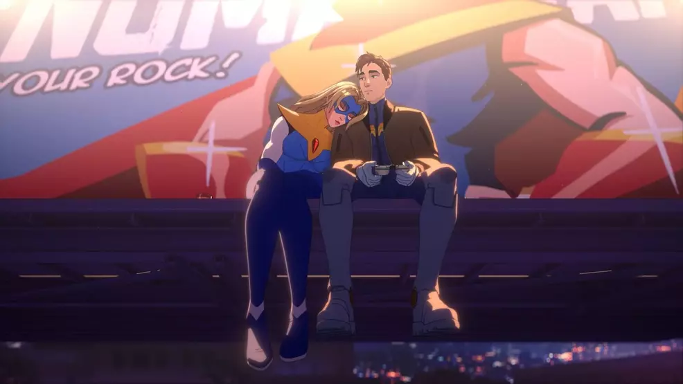 Blonde Blazer and Robert sitting on a billboard.