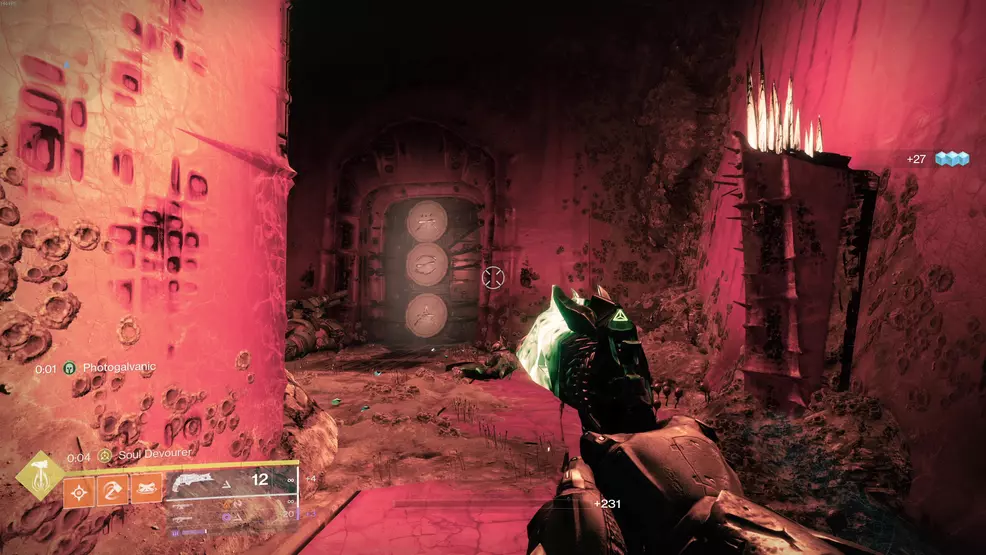A Hive rune door in a red-lit room in Destiny 2.